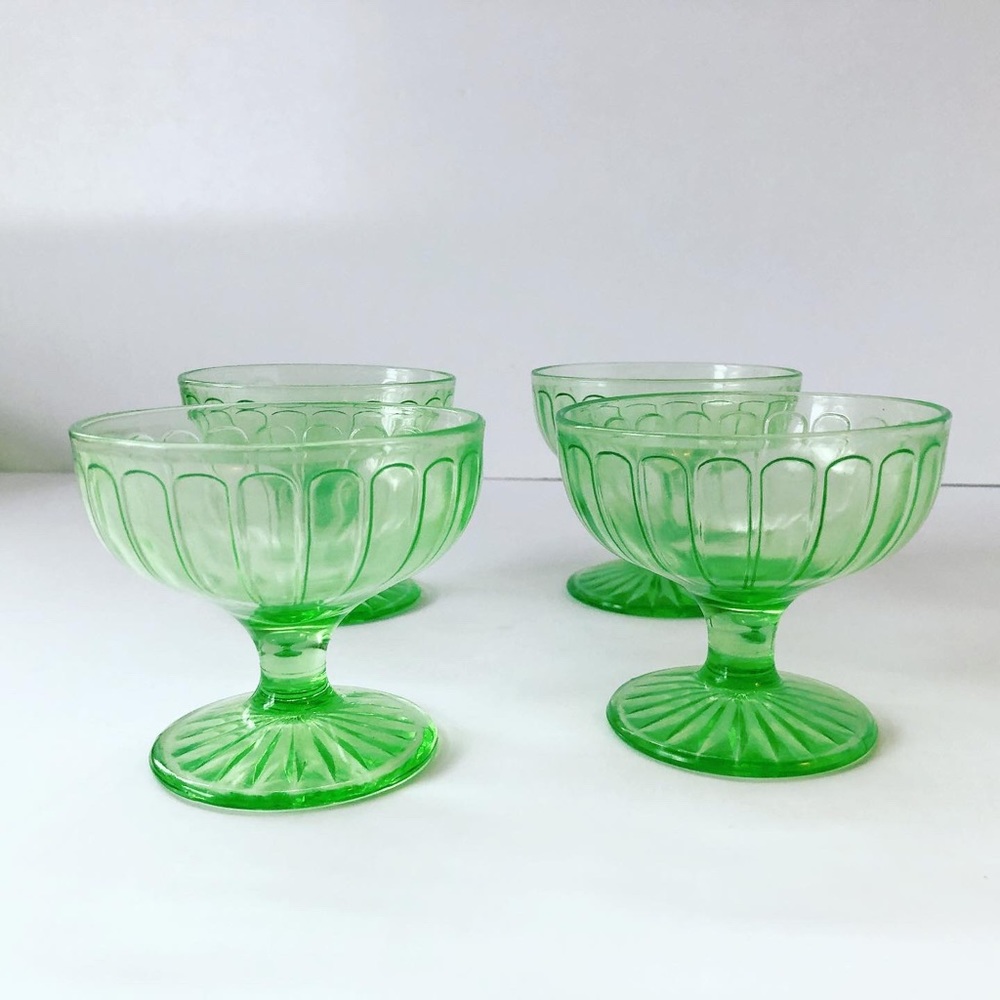Set of 4 vintage green depression glass bowls.